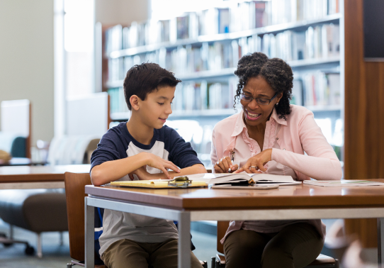 woman tutoring child 1